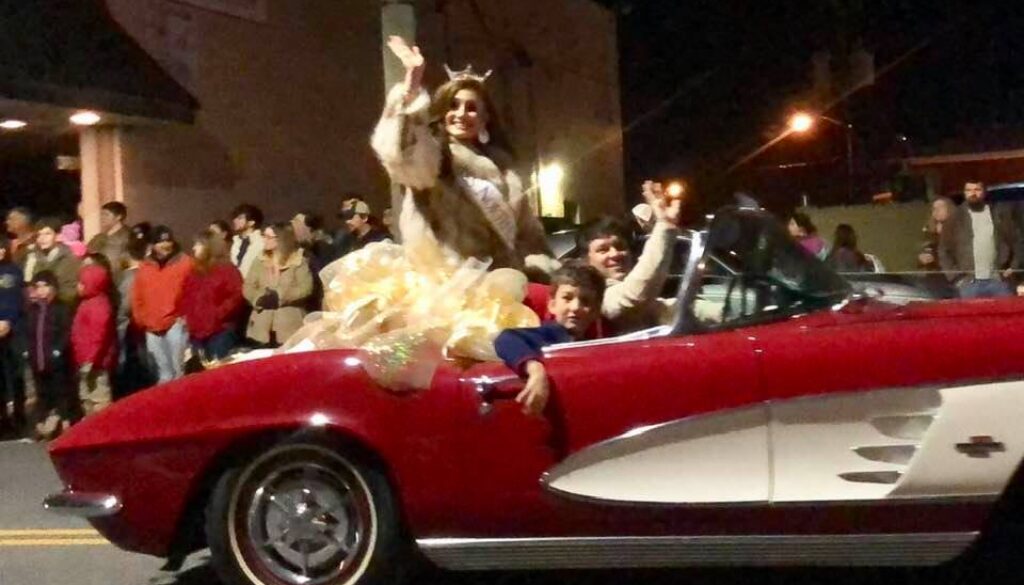 Miss North Carolina Laura Matrazzo rides in a vintage Corvette provided by Wayne Thomas Chevrolet in the 2018 Asheboro Christmas Parade. (The North State Journal)