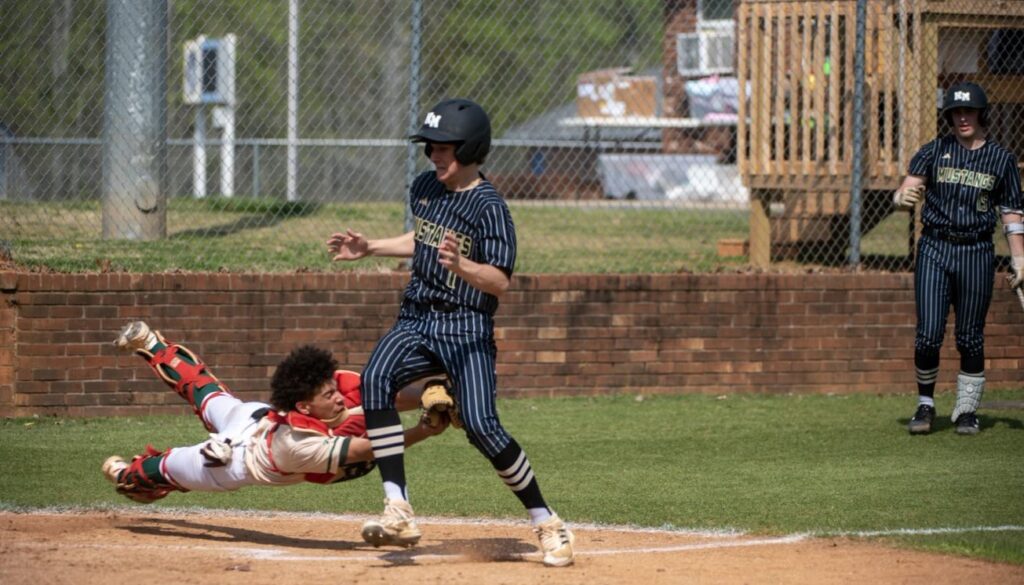 ER baseball K Graham makes tag v N Moore April2023