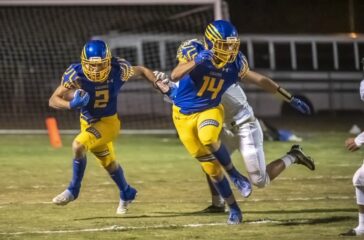 SWR football Adam Cole runs behind Eli Gravely v ER in 2022