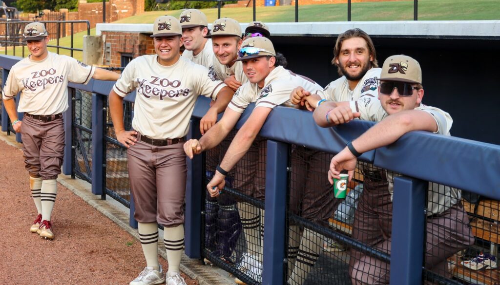 ZooKeepers front of dugout at UNCG June 9 2023